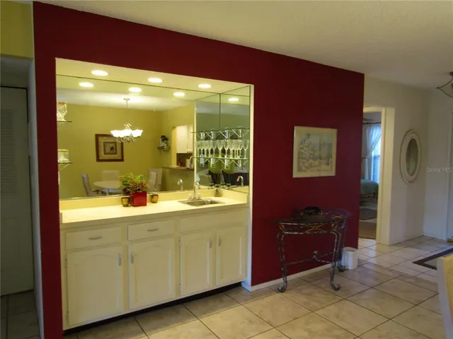 a bathroom with a sink a mirror and a shower