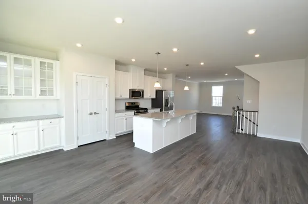 a view of kitchen with sink and wooden floor