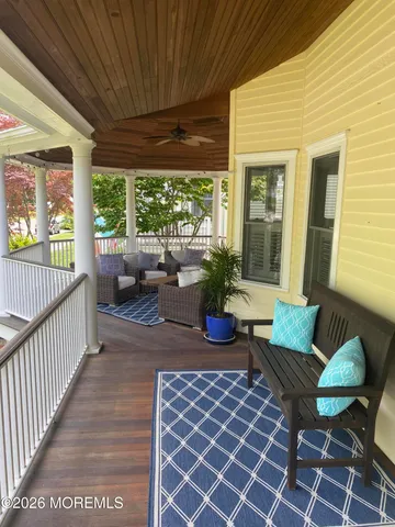 a view of a patio with couches chairs and potted plants
