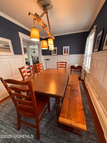 a dining room with a table and chairs