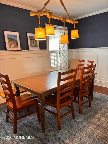 a backyard of a house with barbeque oven table and chairs