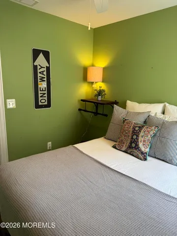 a bedroom with a bed and lamps