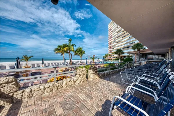 a view of a backyard with sitting area