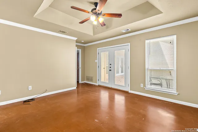 wooden floor in an empty room with a window