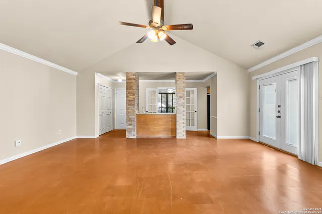 a view of an empty room with a window