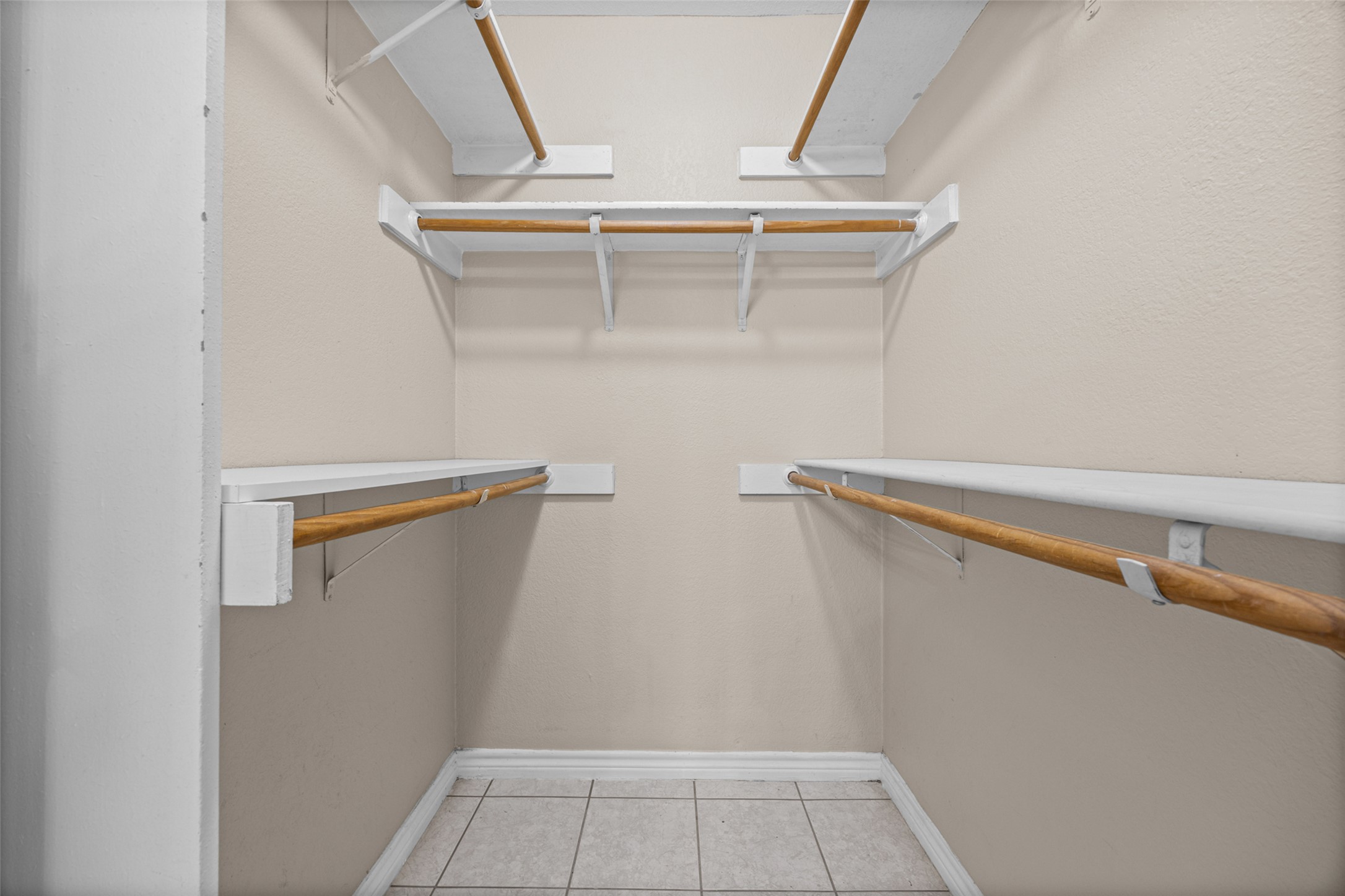 2432 Roundabout Lane Round Rock, TX 78664 - Photo 14 of 22 Functional closet featuring ample shelving and hanging rods to keep belongings organized.
