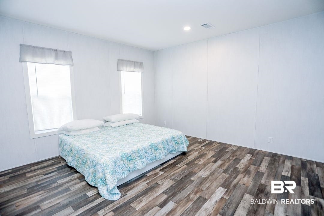 19180 Horseshoe Circle Seminole, AL 36574 - Photo 27 of 38 Bedroom featuring recessed lighting and dark wood-style flooring