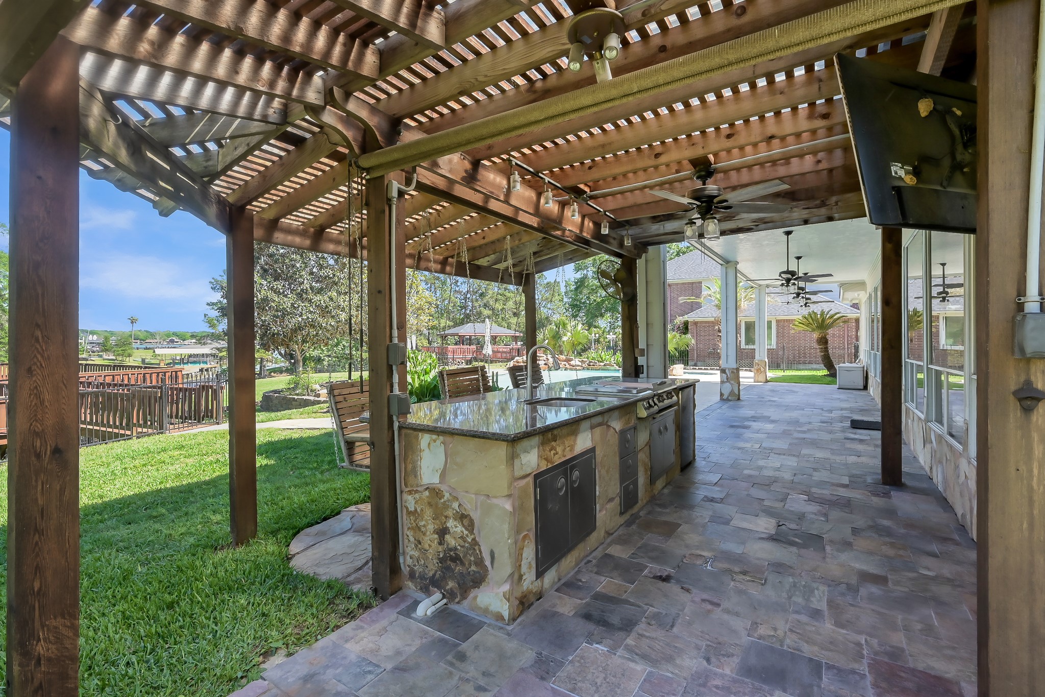 12758 Aries Loop Willis, TX 77318 - Photo 34 of 48 View of the Large Patio and Outdoor Kitchen
