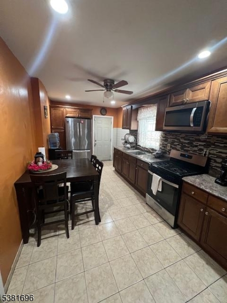 245 William Street Rahway, NJ 07065 - Photo 2 of 8 a kitchen with a cabinets and chairs