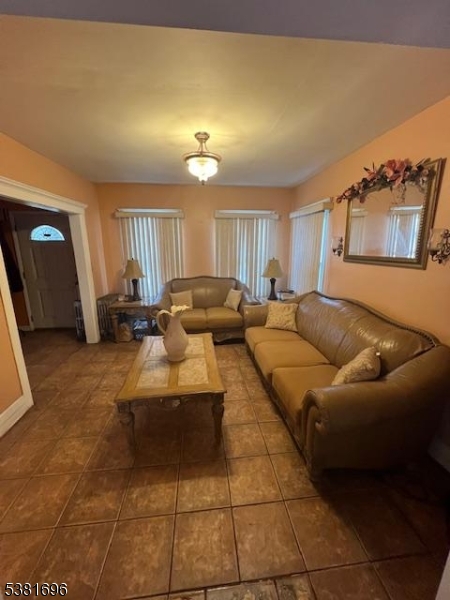245 William Street Rahway, NJ 07065 - Photo 4 of 8 a living room with furniture and a window