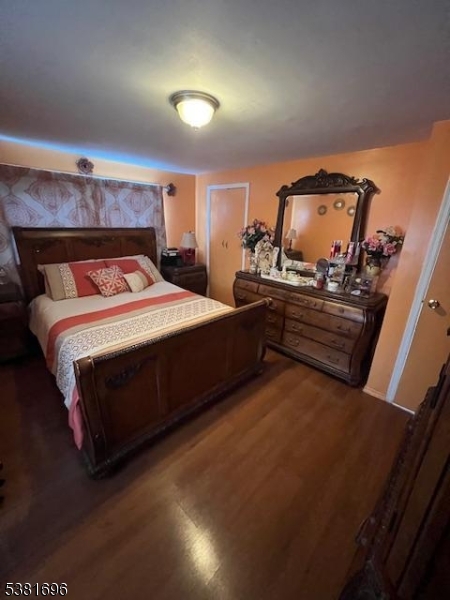 245 William Street Rahway, NJ 07065 - Photo 6 of 8 a bedroom with a bed and a dresser