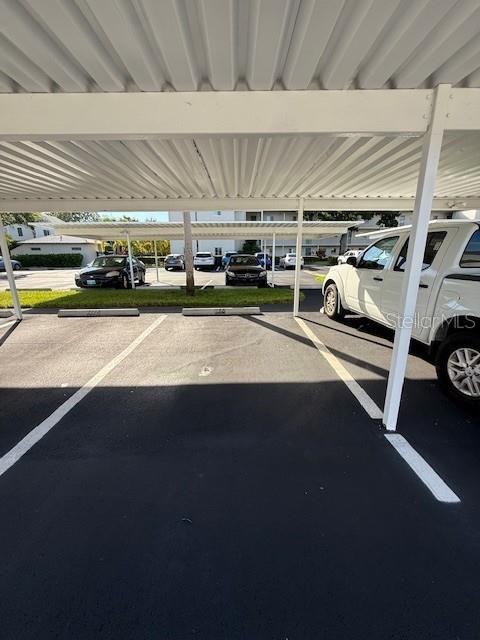 2737 Enterprise Road East, Unit 152 Clearwater, FL 33759 - Photo 26 of 33 a view of parking garage with cars