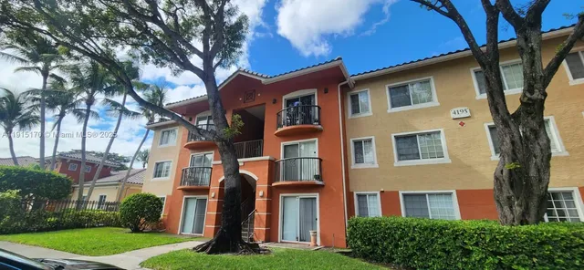 a front view of a residential houses with yard