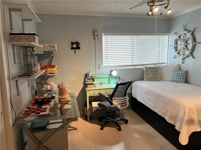 a bedroom with bed and a window