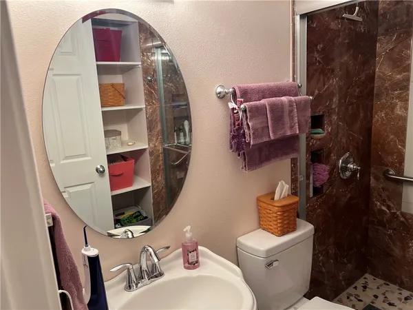 a bathroom with a toilet and a sink