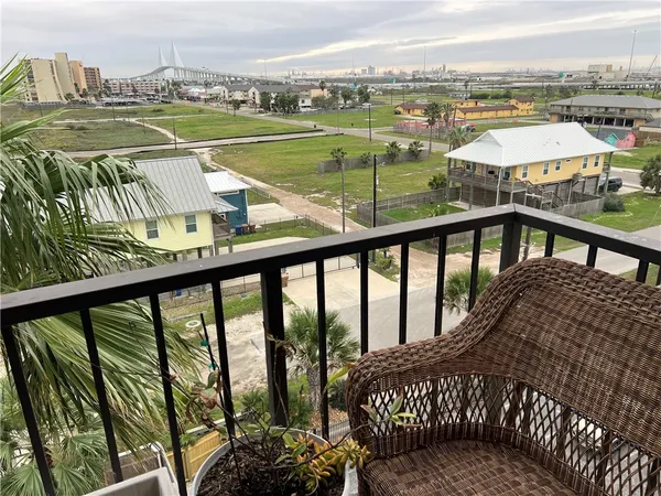 a view of a balcony with lake view and a floor to ceiling window