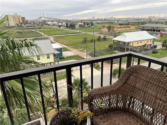 a view of a balcony with lake view and a floor to ceiling window
