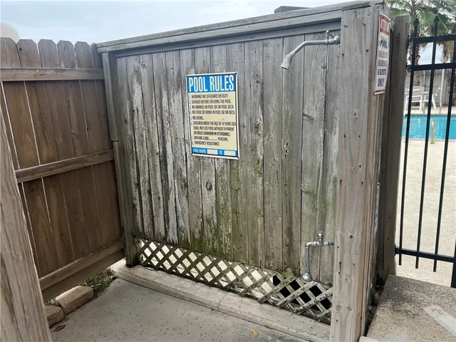 a view of a porch with wooden floor