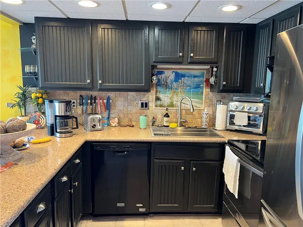 a kitchen with wooden cabinets and a sink