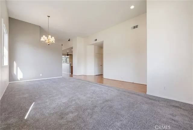 a view of a chandelier in big room and chandelier