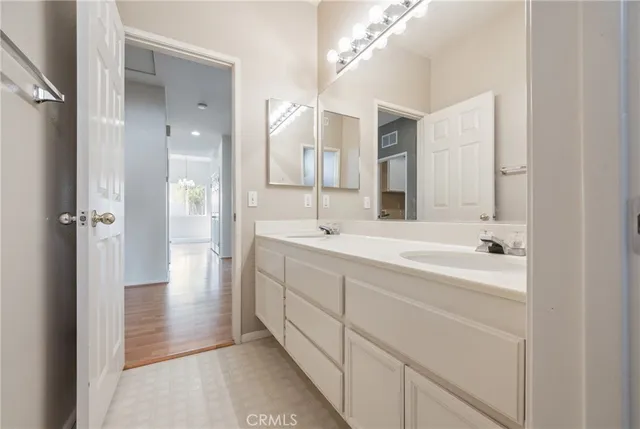a white toilet sitting next to a bath tub and a shower