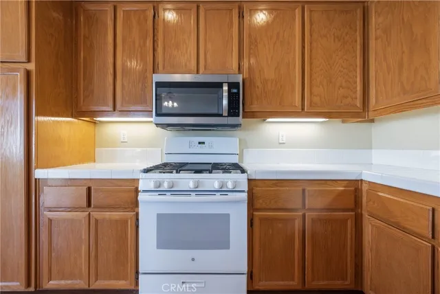 a kitchen with a stove and a microwave