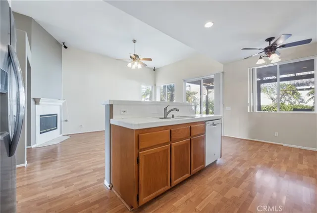 a spacious bathroom with a granite countertop sink a mirror and a shower