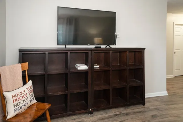 a room with a chair and wooden floor