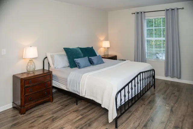 a bedroom with double bed and a window