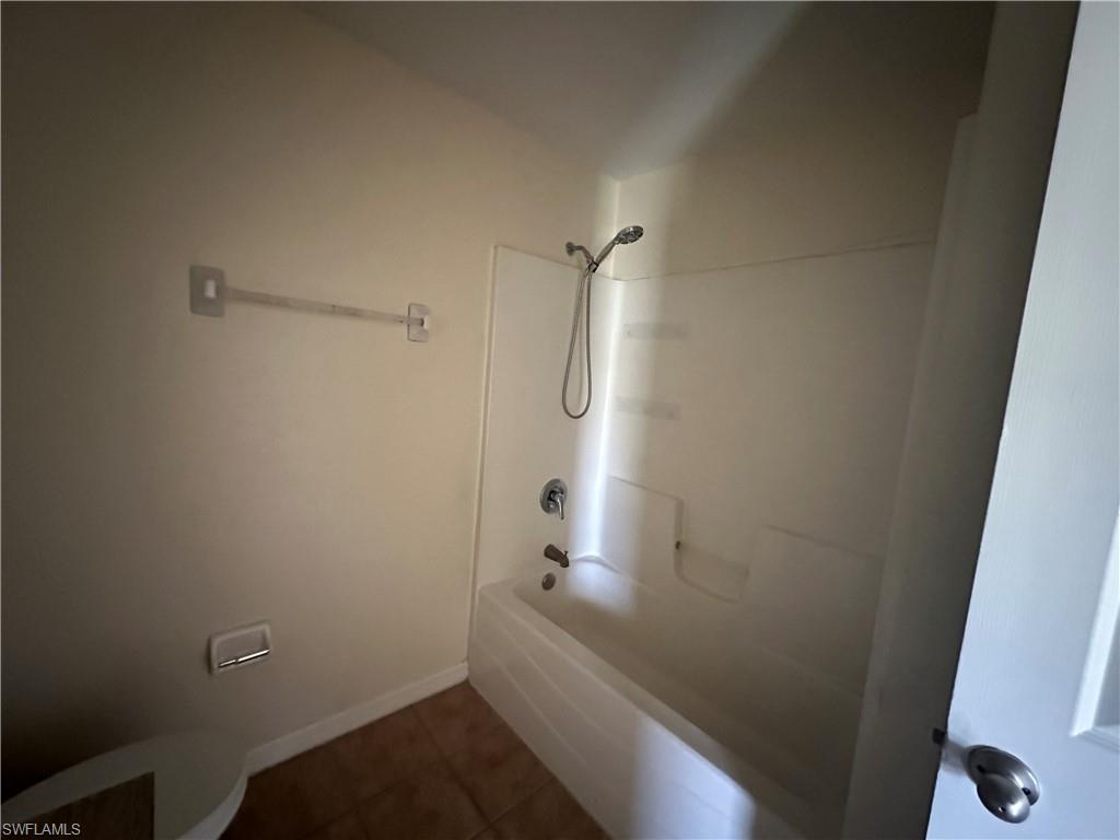 3965 20th Street West Lehigh Acres, FL 33971 - Photo 13 of 18 a bathroom with a bathtub