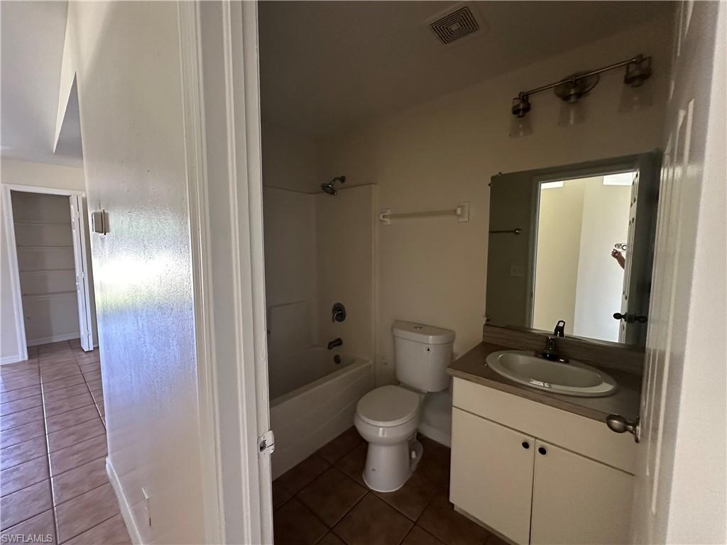 3965 20th Street West Lehigh Acres, FL 33971 - Photo 15 of 18 a bathroom with a granite countertop sink toilet and shower