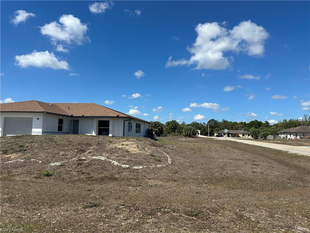 3965 20th Street West Lehigh Acres, FL 33971 - Photo 17 of 18 a view of a house with a yard
