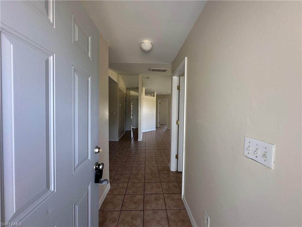 3965 20th Street West Lehigh Acres, FL 33971 - Photo 2 of 18 a bathroom with a shower and a glass door