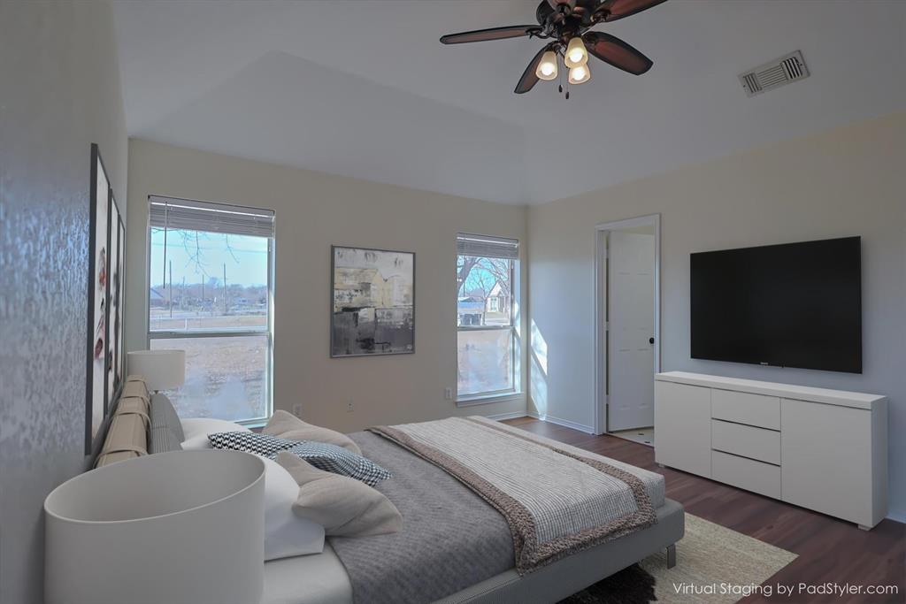 7848 Nine Mile Bridge Road Fort Worth, TX 76135 - Photo 12 of 36 a bedroom with a bed and a flat screen tv