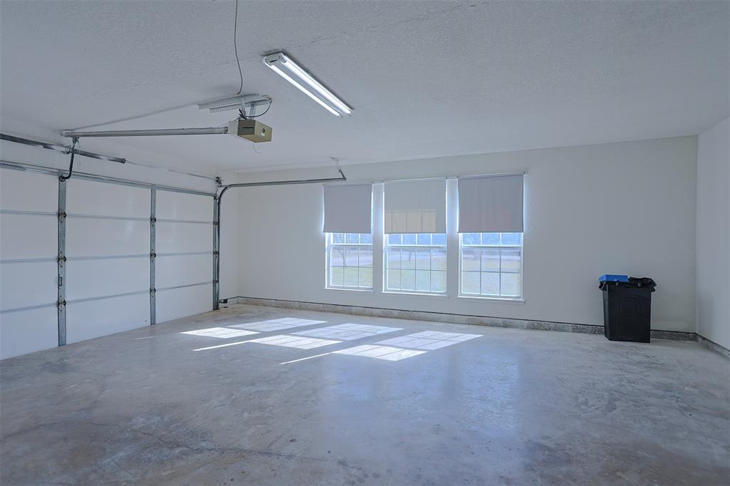 7848 Nine Mile Bridge Road Fort Worth, TX 76135 - Photo 21 of 36 a view of an empty room with a window