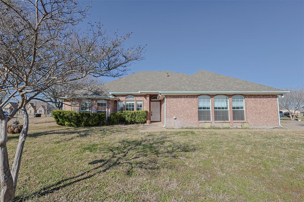 7848 Nine Mile Bridge Road Fort Worth, TX 76135 - Photo 23 of 36 a front view of a house with a yard