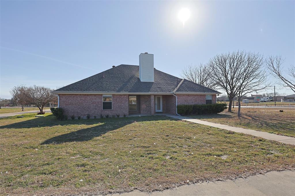 7848 Nine Mile Bridge Road Fort Worth, TX 76135 - Photo 25 of 36 a front view of a house with a yard