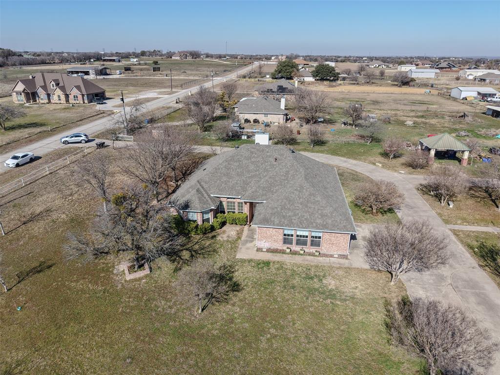 7848 Nine Mile Bridge Road Fort Worth, TX 76135 - Photo 28 of 36 an aerial view of residential houses with outdoor space