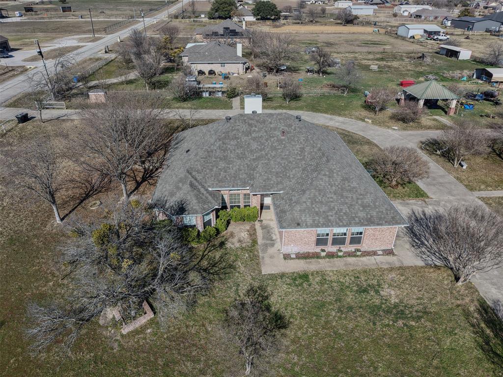 7848 Nine Mile Bridge Road Fort Worth, TX 76135 - Photo 29 of 36 an aerial view of a house with a yard