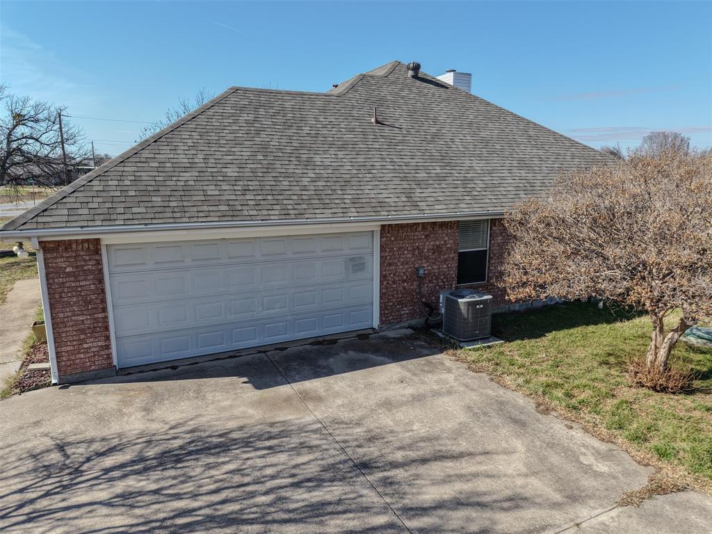 7848 Nine Mile Bridge Road Fort Worth, TX 76135 - Photo 35 of 36 a front view of a house with a yard