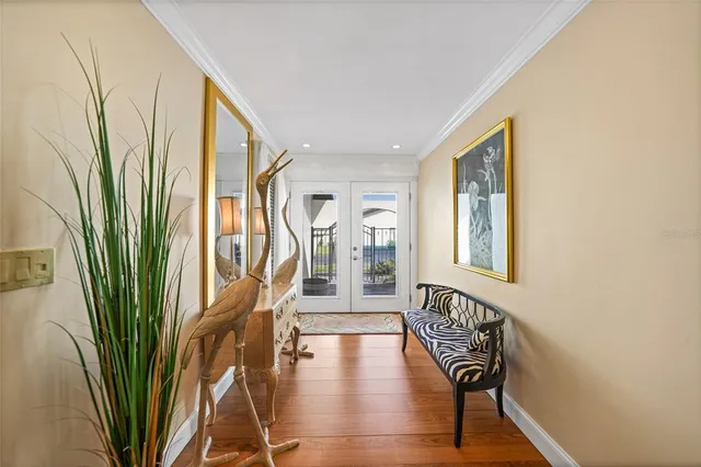 a view of entryway with wooden floor and stairs