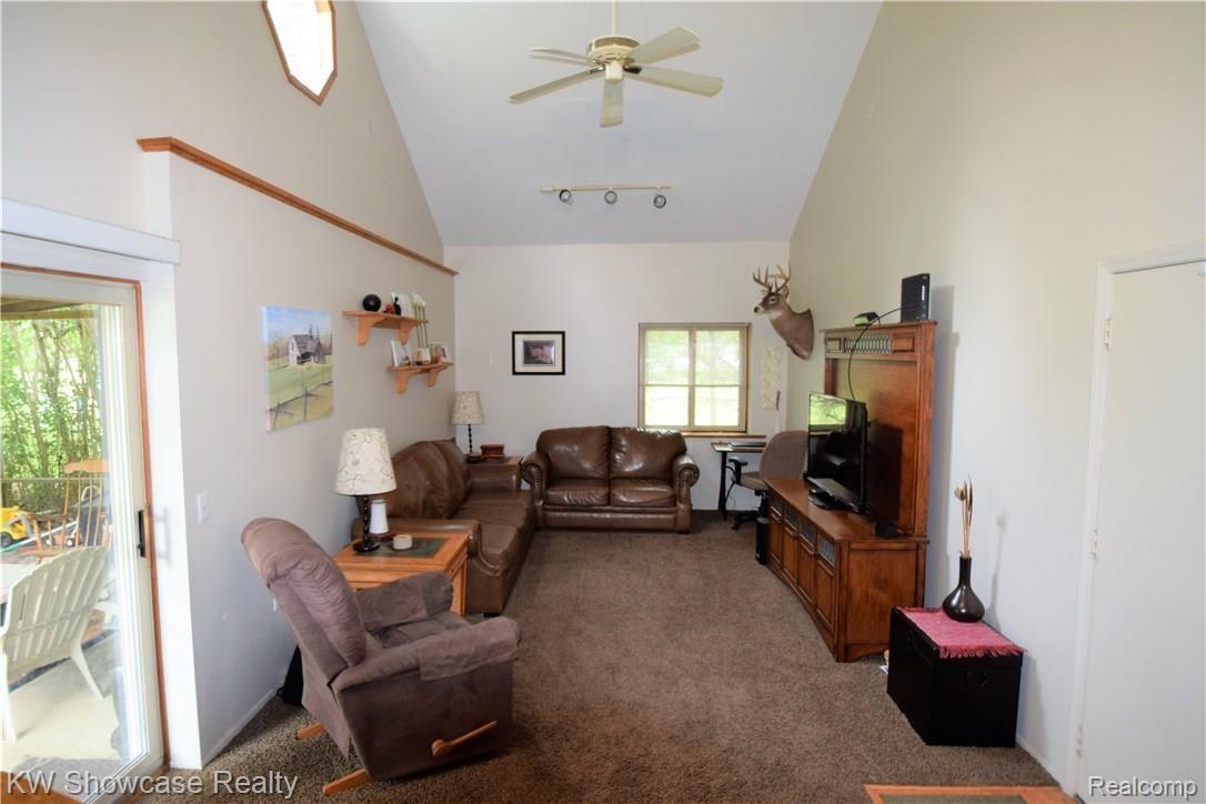 17350 Fish Lake Road Holly, MI 48442 - Photo 15 of 30 Family living room with vaulted ceiling, patio door.