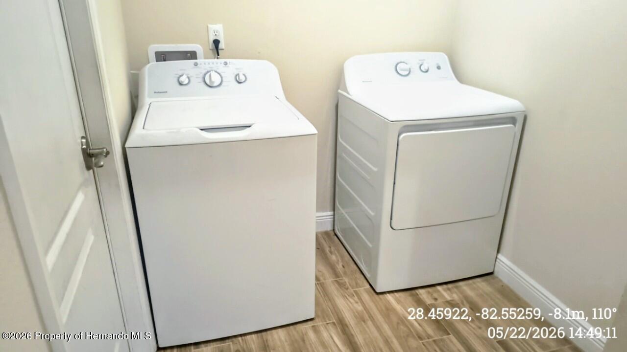 10244 Heathcliff Street Spring Hill, FL 34608 - Photo 26 of 30 a utility room with dryer and washer