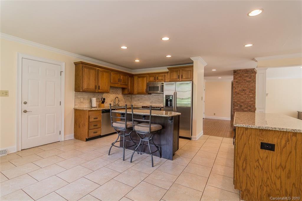 320 Regency Road Salisbury, NC 28147 - Photo 22 of 40 a kitchen with a sink a counter top space and stainless steel appliances