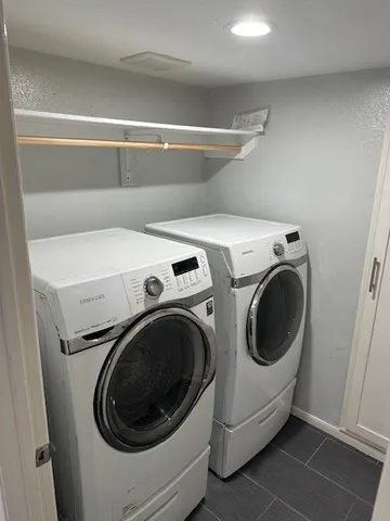a utility room with dryer and washer
