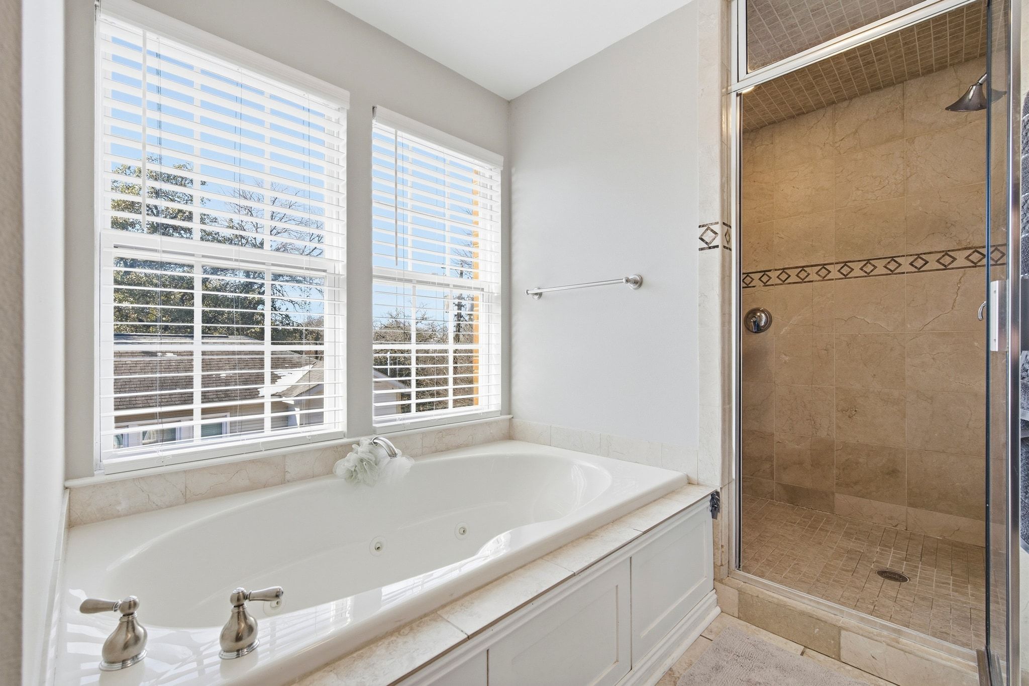2413 Enfield Road Austin, TX 78703 - Photo 12 of 38 a bathroom with a bathtub and shower