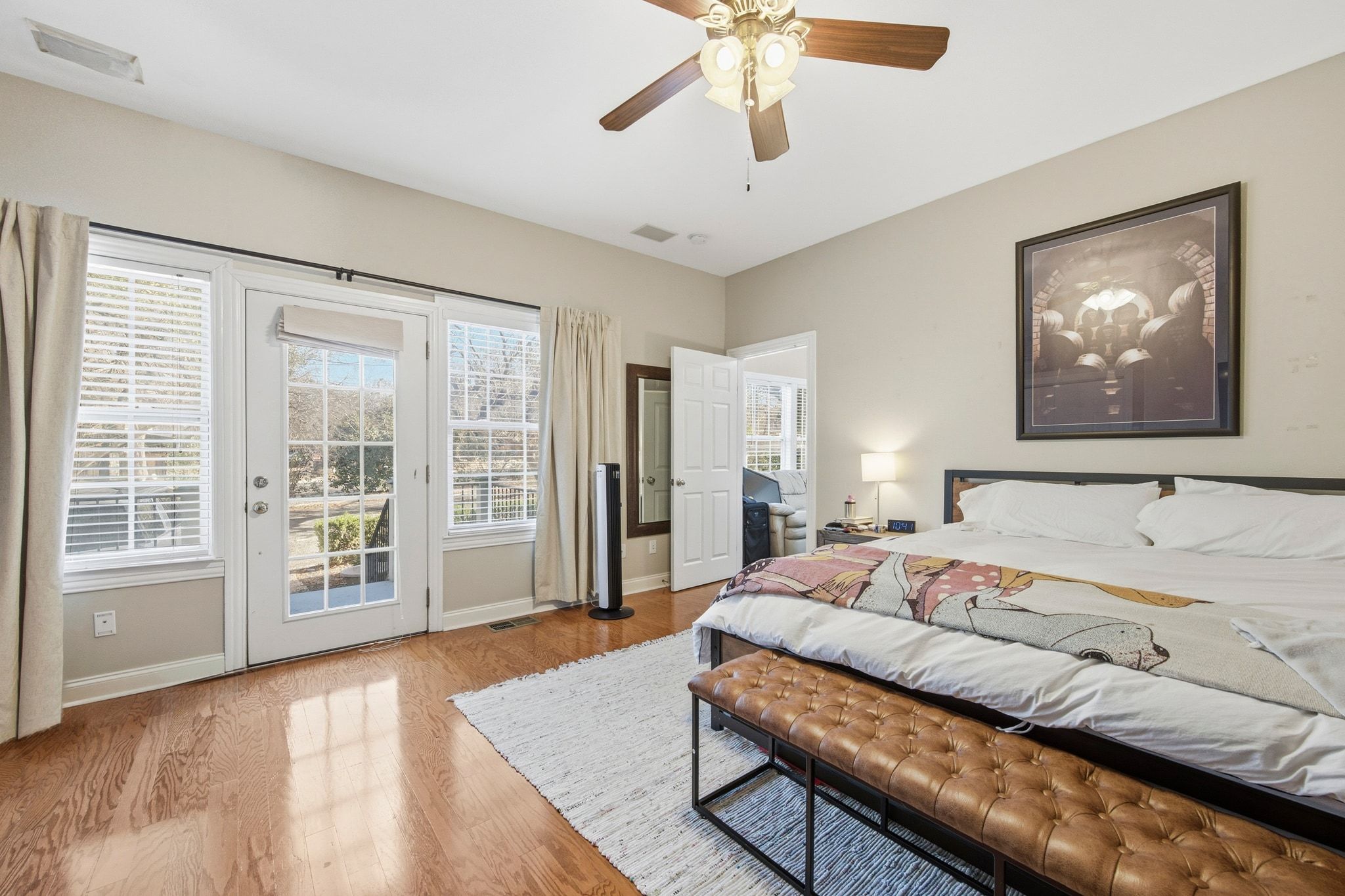 2413 Enfield Road Austin, TX 78703 - Photo 13 of 38 a bedroom with a large bed and a large window