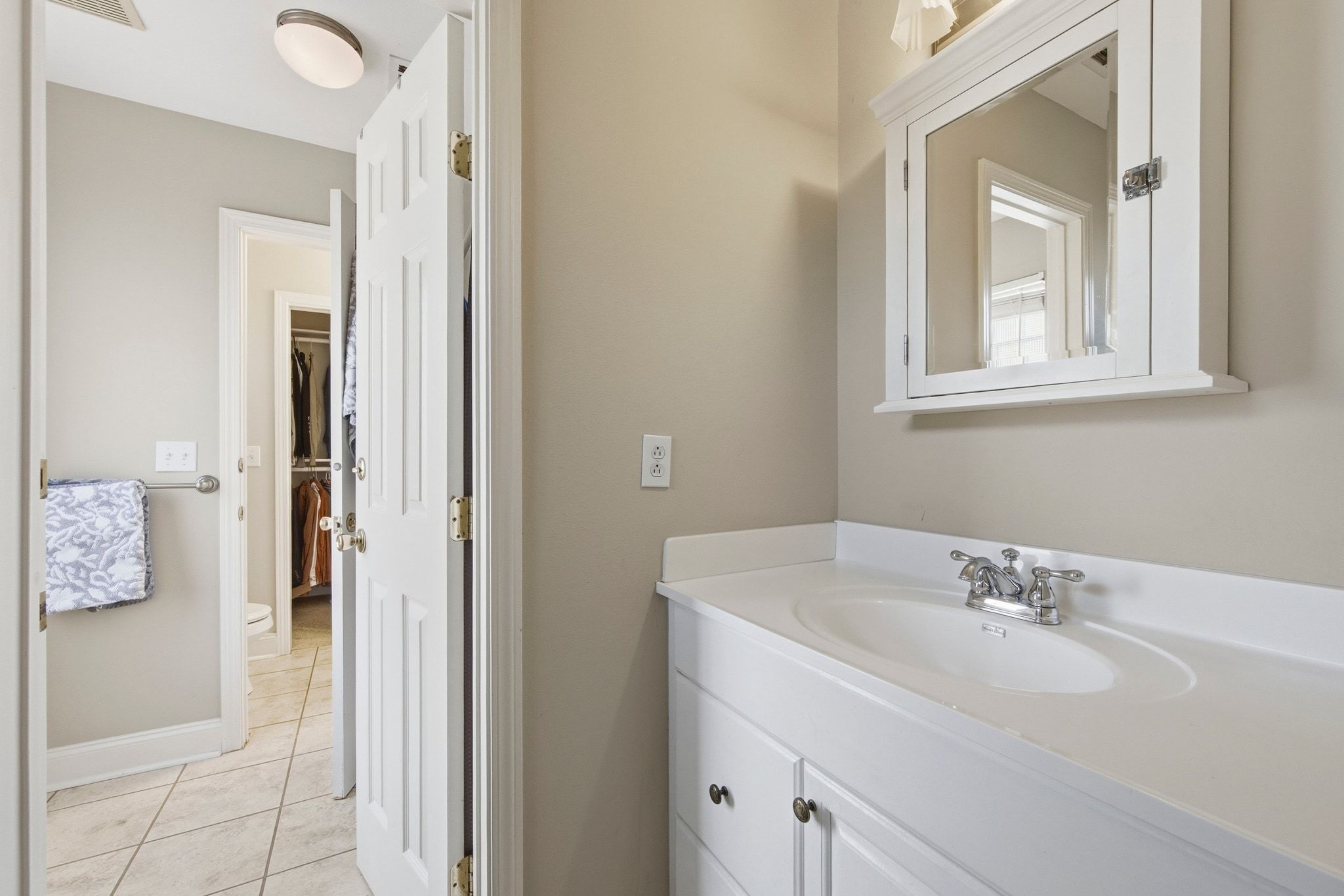 2413 Enfield Road Austin, TX 78703 - Photo 14 of 38 a bathroom with a sink and a mirror