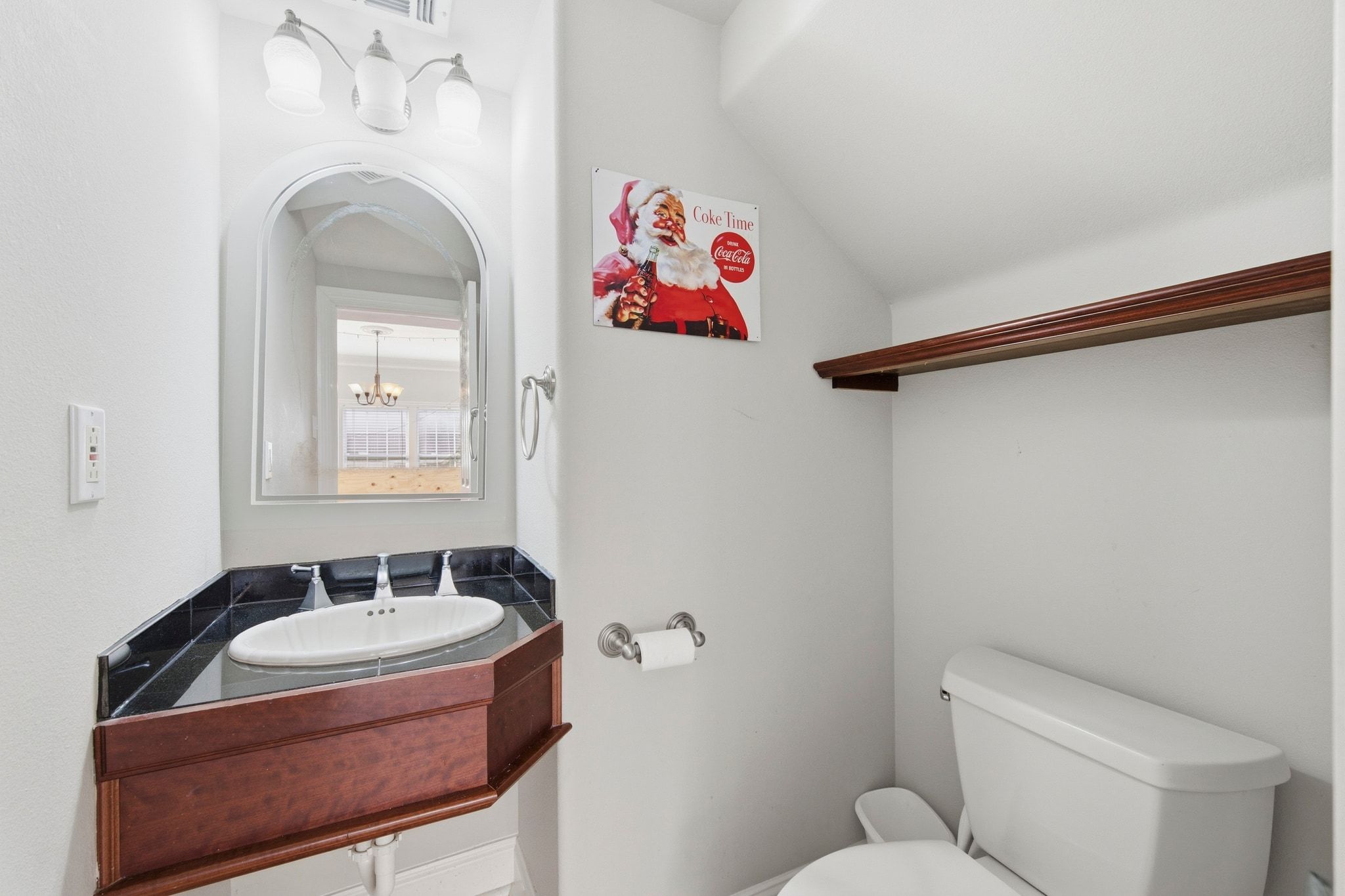 2413 Enfield Road Austin, TX 78703 - Photo 16 of 38 a bathroom with a sink and a mirror
