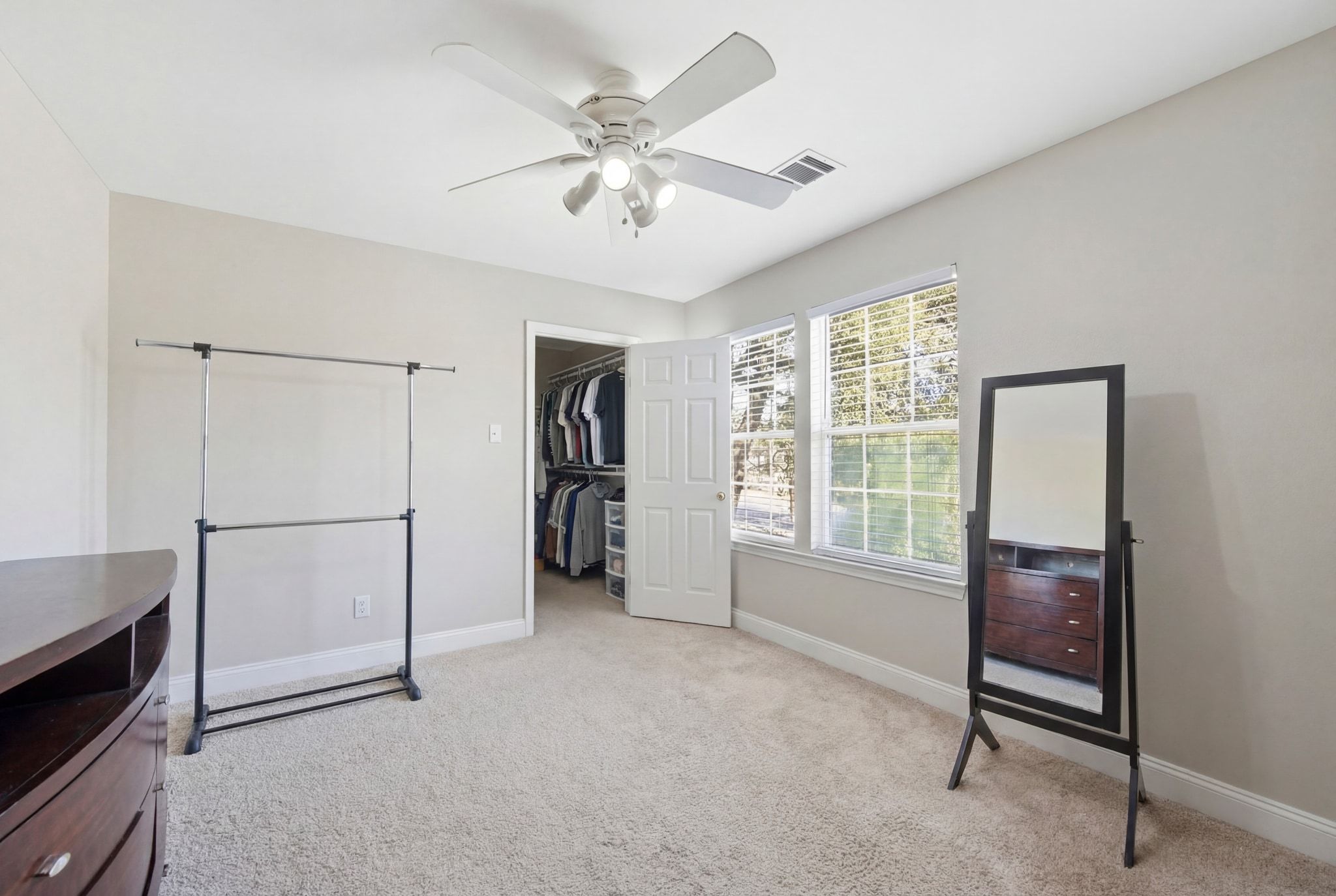 2413 Enfield Road Austin, TX 78703 - Photo 20 of 38 a view of livingroom with furniture cabinet ceiling fan and window